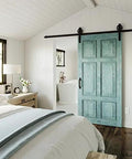Decorative Interior Sliding Barn Door Hardware Spoke Wheel Kit For 72 Inch Doors In Oil Rubbed Bronze Includes All Mounting Hardware For Easy Installation Perfect For Rustic Gate Shed Or Stall Doors Adds Privacy And Style shown installed in a bedroom.