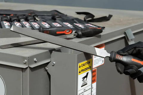 Person using Ergonomic 9 Piece File Set With 6 Inch 8 Inch 10 Inch And 12 Inch Bastard And Tapered Files Multicolor Handles Pro Grade Metalworking Maintenance Tool Kit For Precision Shaping And Deburring on a metal surface
