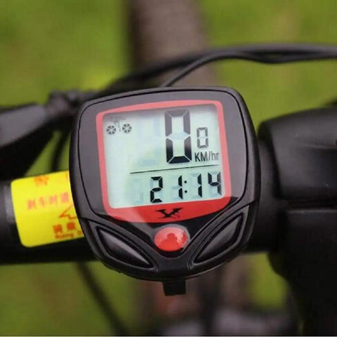 Compact LCD Bike Computer with Odometer and Speedometer mounted on handlebars displaying speed and time.