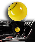Universal JDM Racing Smile Face Yellow Resin Gear Shift Knob For Manual 5 Or 6 Speed Cars with easy adapters, installed view.