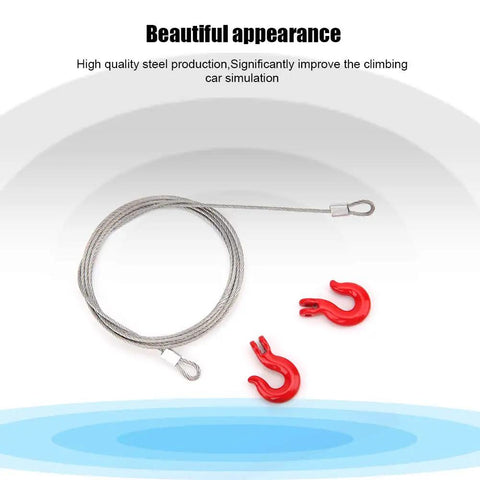 Three Piece RC Car Steel Rope Pulley Lock Sleeve Set for 1 10 Scale Crawlers, Snatch Block Winch Tow Strap Hook Trailer Kit for Gnarly Climbing Action, Durable Steel Construction for Rugged Trails. Steel RC rope and red hooks on white background.