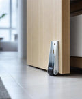 Rock Solid Vertical Track Roller Wheels For Sliding Barn Doors Featuring Quiet Rubber Casters And Reinforced Bearings installed on a wooden door.
