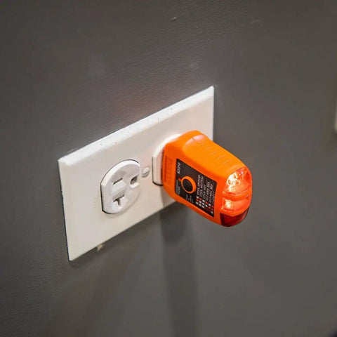 RT210 Outlet Tester For GFCI And Standard Receptacles plugged into wall demonstrating electrical safety check for homeowners.