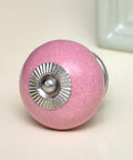 50 Pack Slick Pink Ceramic Crackle Drawer Knobs With Rounded Handles For Kitchen Cabinets And Wooden Dressers showing shiny pink knob.