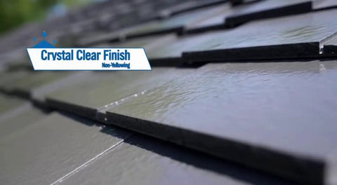 Close-up of a roof with a shiny, crystal clear finish showing the non-yellowing effect of Heavy Duty Tough As Nails Clear Roof Sealer Stops Leaks Cold For Seven Years While Delivering Waterproof Armor For Metal Copper Concrete Roofs And Skylights In A Real Deal Five Gallon Size.