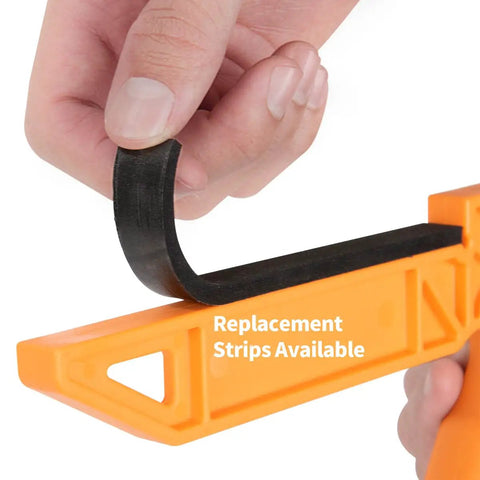 Hand holding a black replacement strip for Dual Grip L Shaped Push Sticks To Keep Your Digits Safe During Hard Woodworking Jobs.