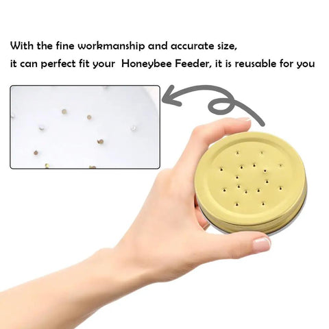 Hand holding a lid from Ten Pack Metal Bee Entrance Feeders 2.87 Inch For Beehives, reusable equipment for busy beekeepers
