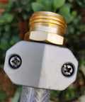 Close-up of Tough As Nails Heavy Duty Garden Hose Repair Fittings Kit Aluminum Mender Coupler with clamp and screws