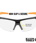 Top Tier Semi Frame Safety Glasses With Clear Lens Pack Serious Eye Protection And Scratch Resistant Coating Built Tough For The Daily Grind While Giving Comfy Wrap Around Coverage That Keeps Your Vision Sharp On Site. Close-up of safety glasses showing non-slip nose pieces and orange side grips.