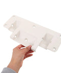 White aluminum adjustable bed rail brackets for home beds, drop down safety rails, showing size and mounting holes held by hand.