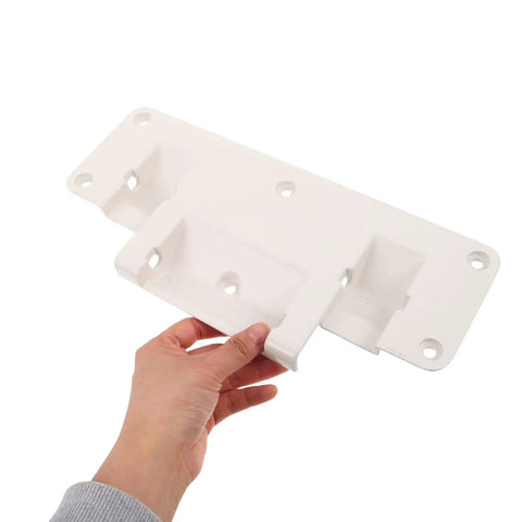 White aluminum adjustable bed rail brackets for home beds, drop down safety rails, showing size and mounting holes held by hand.