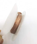 Spool of Pro Grade Desoldering Braid Solder Wick for BGA Rework, 1.5mm Copper Wire, in hand for electronics repair.
