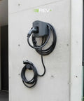 Universal Dual Port Level 2 EV Charging Station With 50 Amp Home Electric Vehicle Setup And Slick 18 Foot Cord mounted on a wall.