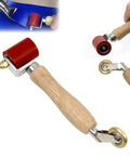 Wooden-handled seam roller with red silicone wheel and 6mm brass detail penny roller