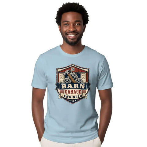 Classic Retro Mechanical Engineer Tee With Vintage Barn Garage Gear Badge Design For Hands-On Builders And Tool Loving Tinkerers In 100 Cotton, worn by a smiling man.