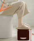 Person using Foldable Bamboo Toilet Stool for Adults 8 Inch Squat Potty with Anti Slip Strips Natural Color No Assembly Portable Bathroom Stool