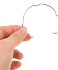 Close-up of hand holding Six Pack Recessed Light Spring Clips Made From Manganese Steel With High Elasticity For A Secure Fixture