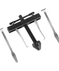 Front view of automotive universal crankshaft/camshaft puller kit with central threaded screw and four steel forks.