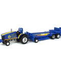 One Sixty Four Scale FFA Die Cast Pulling Tractor With Sled Nine Inch Long Farm Toy For Ages 3 Plus Totally Great For Collectors And Backyard Pulling Fun showing blue die-cast tractor and sled combination