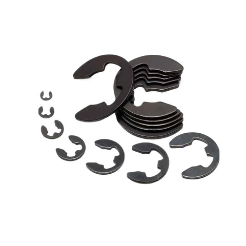 Get Those Shaft Parts Locked Down Tight With These Steel Circlips, E Clips And Retaining Rings In Assorted Sizes For Machinery Gear Fixing, assorted steel E clips laid out.
