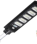 JUDYSSY Solar Lights Outdoor - 300W Led Solar Street Light Motion Sensor with remote control, showcasing the light and control features.