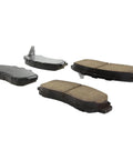 Four Centric Posi-Quiet ceramic front brake pads for select Honda model years.