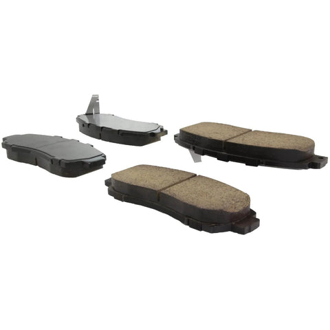 Four Centric Posi-Quiet ceramic front brake pads for select Honda model years.