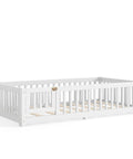 Totally Built Tough Twin Floor Bed With Montessori Design And Complete Safety Guardrails Plus Easy Access Door For Kids, Solid Wood low profile slatted frame in fresh white.