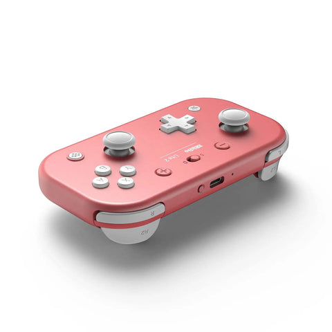 Pocket Sized Lite 2 Bluetooth Controller With Motion Controls, Linear Vibration Motors, Dual Joysticks, Shaped Triggers And D Pad, Wireless Gamepad For Nintendo Switch On The Go, Switch 2, Android And Raspberry Pi, Pink on white background