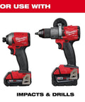 Milwaukee red cordless hammer drill and impact driver with M18 batteries, side-by-side view