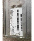 Used Compax-3 Servo Drive Controller For Industrial Automation, Rock-Solid Pre-Owned Servo Driver With Fast Install, High Performance Motion Control Unit For CNC Machines, Robotics, And Precision Equipment. metal servo drive label with barcode on gray industrial controller