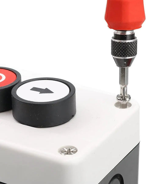 Close-up of 3 Button Industrial Control Station With Up And Down Arrows Center Stop Button Built Tough White And Black Housing