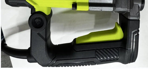 Close-up of the ergonomic handle of a 1500 Watt Heavy Duty Rotary Hammer Drill with safety features.