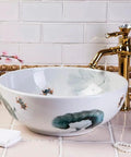 USZWBY Vessel Sinks Art Countertop Basin Round Retro Washbasin Bathroom Ceramic Washbasin with floral design and gold faucet.