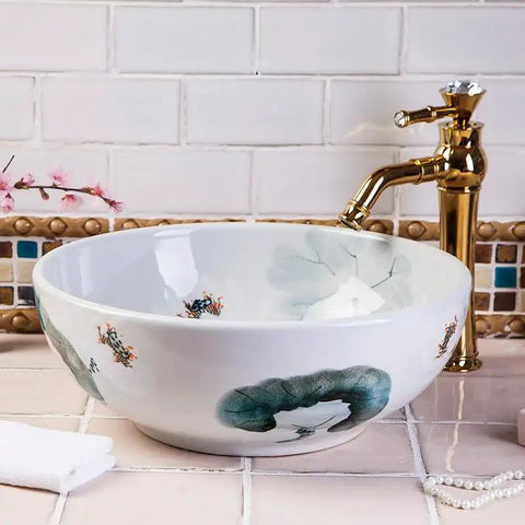 USZWBY Vessel Sinks Art Countertop Basin Round Retro Washbasin Bathroom Ceramic Washbasin with floral design and gold faucet.