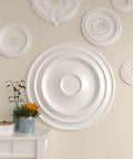 Ceiling Medallion With 32 5/8 Inch Diameter And 1 1/2 Inch Projection, fits canopies up to 7 7/8 inches, on a wall display.