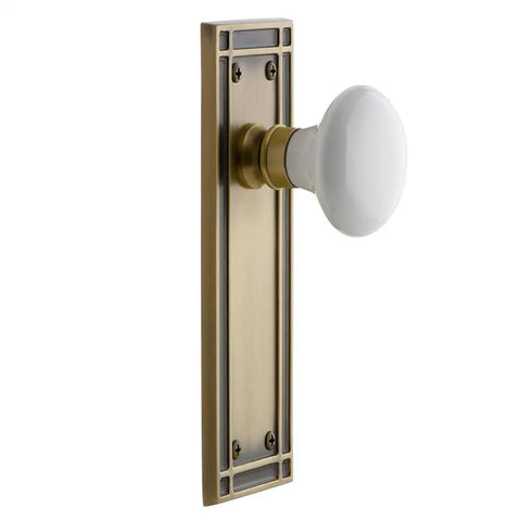 Mission Plate With White Porcelain Knob, Passage Door Hardware In Antique Brass Finish, 2 3 Quarter Inch Backset, Solid Forged Brass Plates