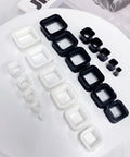 Rectangle Silicone Ear Tunnels And Plugs 00G 10MM Hollow Square Flexible Gauges Set in black and white on display