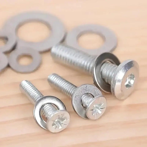 Close-up of screws with 180 Pcs Stainless Steel Flat Washers Set For Screws And Bolts 304 Grade Assorted Sizes on a wooden surface.