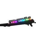 Top Shelf Mechanical Gaming Keyboard Featuring Heavy Duty Aluminum Chassis And Smart Display For Live Game Stats Discord Chats And Spotify Tracks, side view with RGB lighting.
