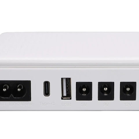 Heavy Duty 20800mAh Mini UPS Battery Backup For Network Routers And Cable Modems Keeps Your WiFi Running Solid Through Grid Snags With Rapid Recharge And Straight Plug Setup For Zero Drama Work From Home, showing input and output ports.