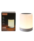 Go-To Smart Touch Bedside Lamp With Bluetooth Speaker Dimmable Color Night Light next to packaging
