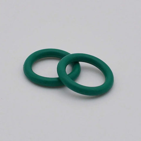 Two green O-rings from Number 10 Cup And O Ring Set For WP 17 18 26 And WP 9 20 TIG Welding Torches 15 Piece Replacement Kit