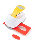 2 Inch Oval Lever Paper Punch For Crafting And Card Making cutting red paper on white background