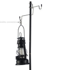 Black lantern hanging from hook on a pole using double small carabiner clips for zipper replacement and theft deterrent.