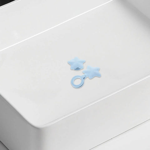 2pcs Star Shaped Silicone Tub Drain Plug for Bathtub Sinks, Fixed in light blue on a white surface, ideal for preventing water leakage.