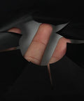 Hand showing cut-to-fit design of Two Pack Gas Stove Burner Covers 0.2mm Double Thickness Reusable Gas Range Protectors For 30 Inch Stoves.