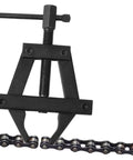 Heavy Duty Motorcycle Chain Adjuster Tool For Bike Gear Tensioning Solid Steel Build shown adjusting motorcycle chain.