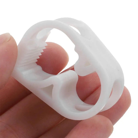 Close-up of hand holding 20 Pack White Plastic Flow Control Tube Clips For 1/4 To 5/16 Inch Tubing Adjustable Pinch Valves