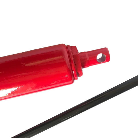 Close-up of red 8-ton hydraulic jack cylinder with clevis lug and long ram